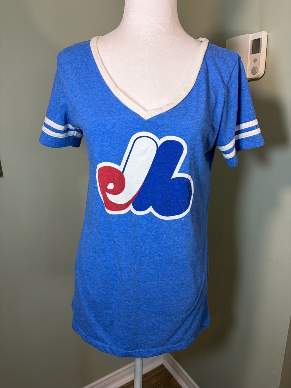 303. Expo 5th & Ocean Blue V-Neck Tee with Red & White Logo